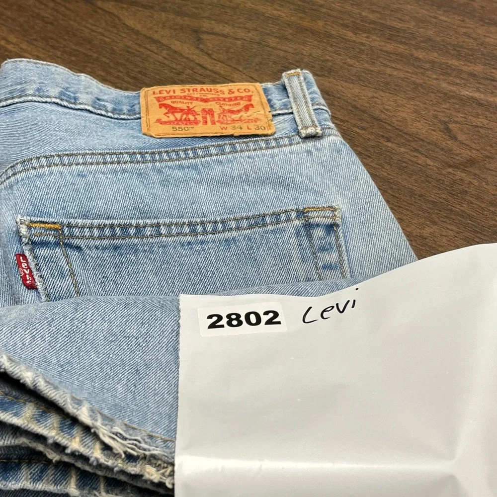 Levis 550 Jeans Mens 34x30 Light Wash Blue Straight Leg 5 Pocket Distressed FLAW